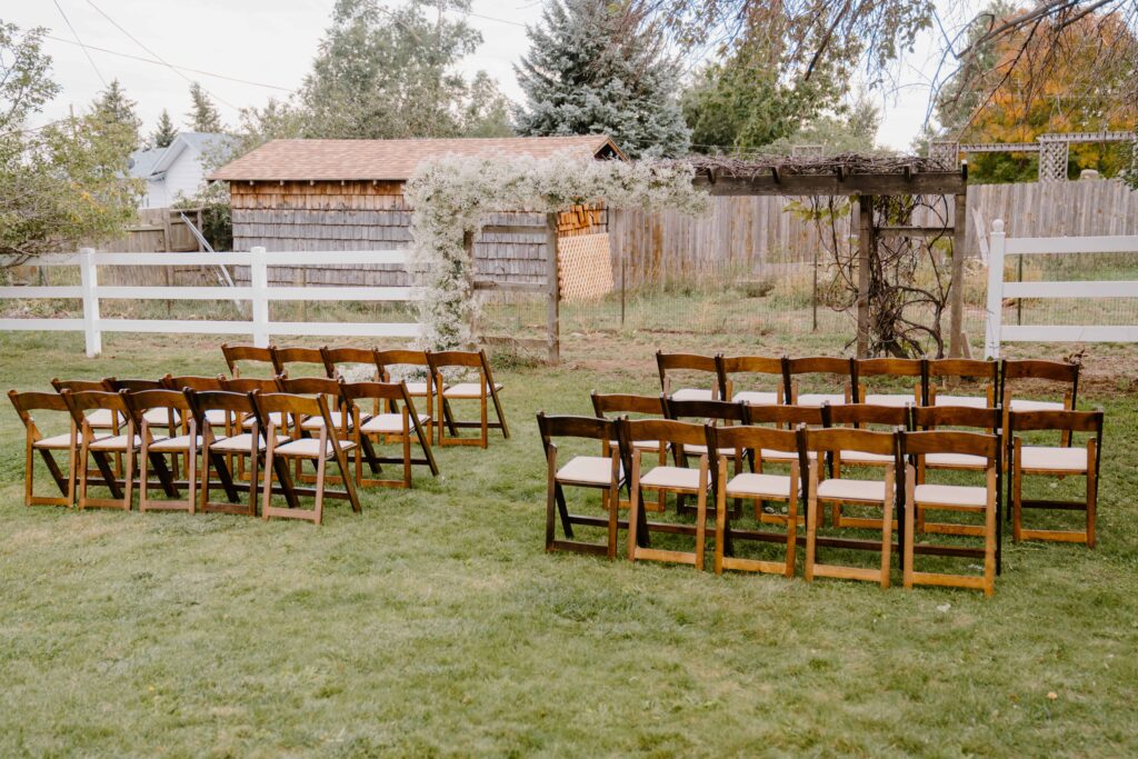 Photo of the ceremony arch and chairs set up for the wedding
