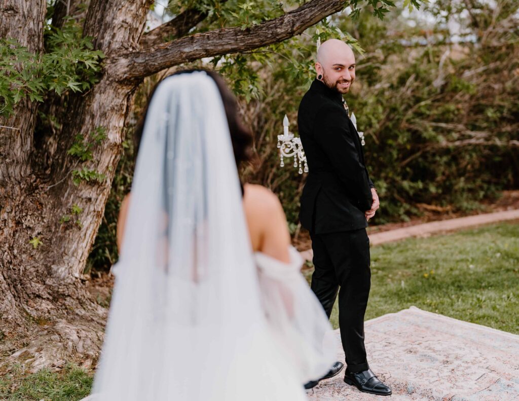 Bride and groom share an emotional first look before their wedding