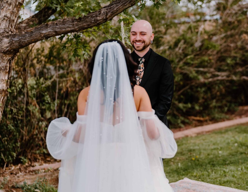 Bride and groom share an emotional first look before their wedding