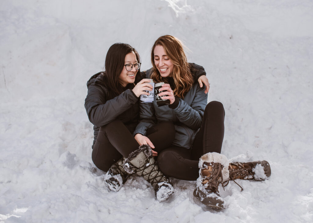 Couple drinks beer together as a newly engaged couple