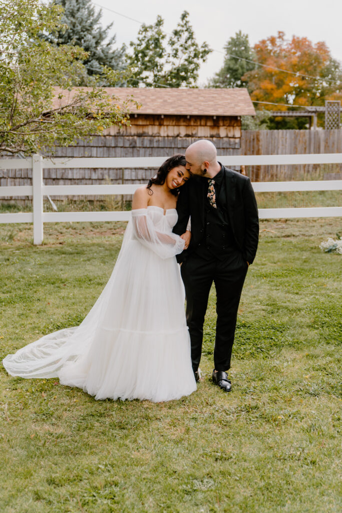 Portrait of bride and groom hugging each other after their wedding