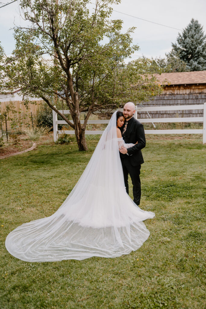 Portrait of bride and groom hugging each other after their wedding