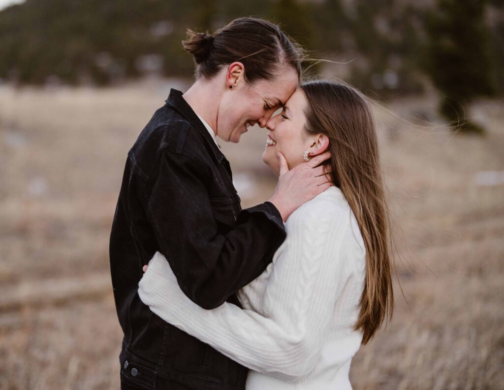 Lesbian couple has their foreheads together for a cute photo session 